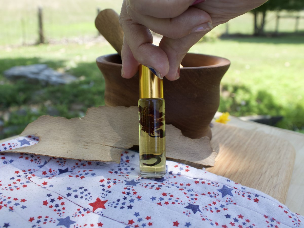 Debby hand-blending a batch of essential oil roller
